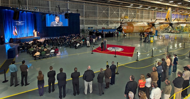 Staff Lt. Gen. Anwer Hamad Amen, Iraqi Air Force Commander, speaks to the crowd inside the main C-130 production line building in Marietta, Ga, Dec. 12, 2012.  The first C-130Js for Iraq were presented at this ceremony to mark the delivery to Iraq. The aircraft in the background is Iraq's fourth of six. (Courtesy photo by Lockhead Martin’s Todd R. McQueen)