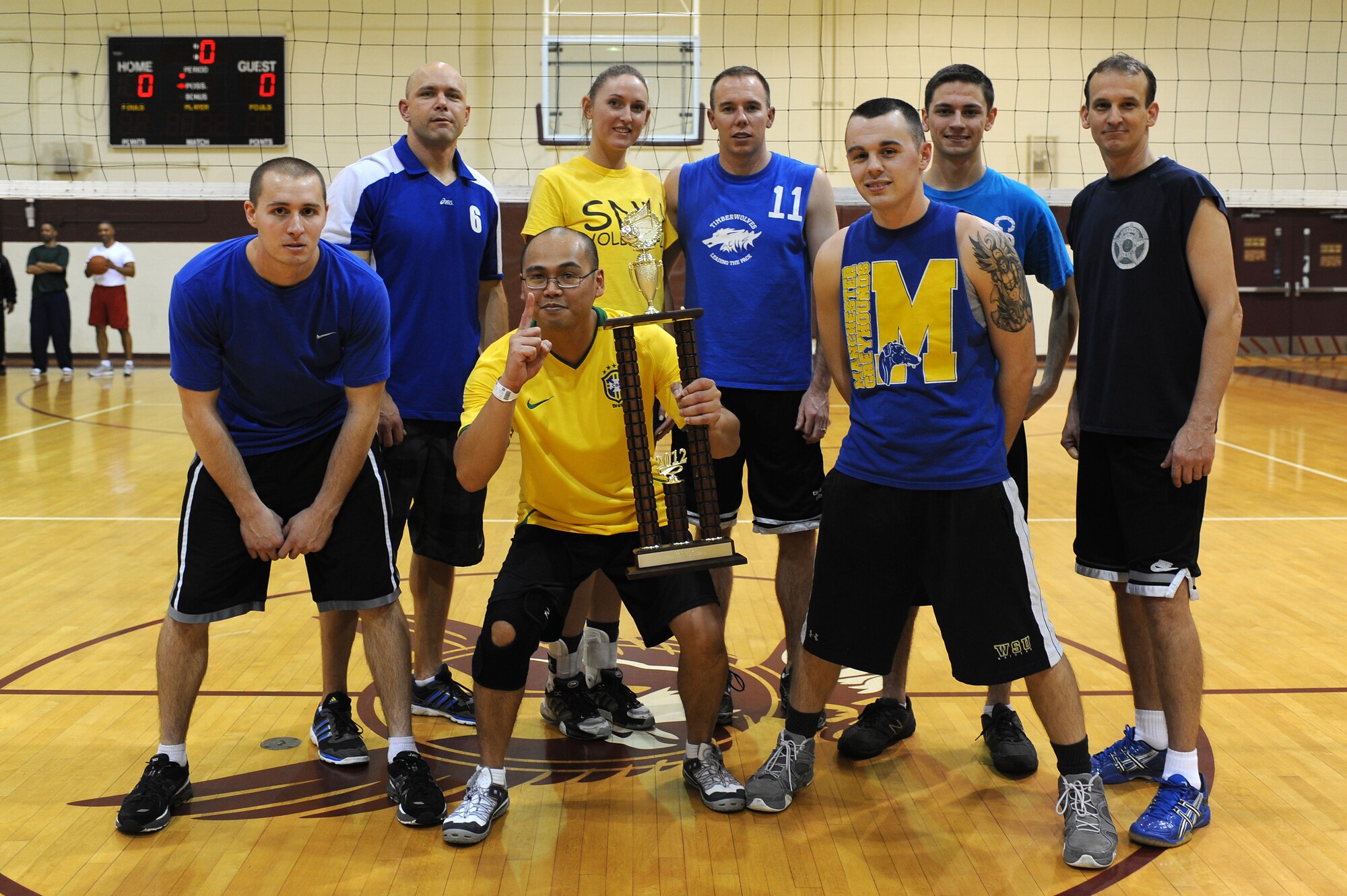 Members of the 4th Component Maintenance Squadron volleyball team pose for a group photo after the intramural championship game at the fitness center on Seymour Johnson Air Force Base, N.C., Dec. 12, 2012. The 4th CMS received both the Volleyball Championship trophy and the Large Squadron Championship trophy. (U.S. Air Force photo/Airman 1st Class John Nieves Camacho/Released)