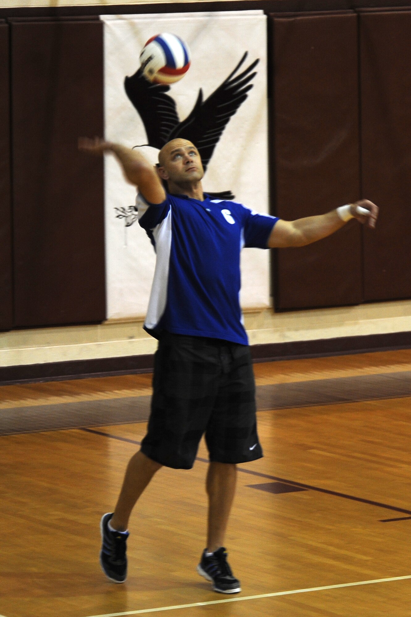U.S. Air Force Master Sgt. Michael Bolechowski, 4th Component Maintenance Squadron test cell section chief, serves a volleyball during the intramural championship game at the fitness center on Seymour Johnson Air Force Base, N.C., Dec. 12, 2012. The 4th CMS won the contest against the 4th Force Support Squadron after coming back from being down 1-0. (U.S. Air Force photo/Airman 1st Class John Nieves Camacho/Released)