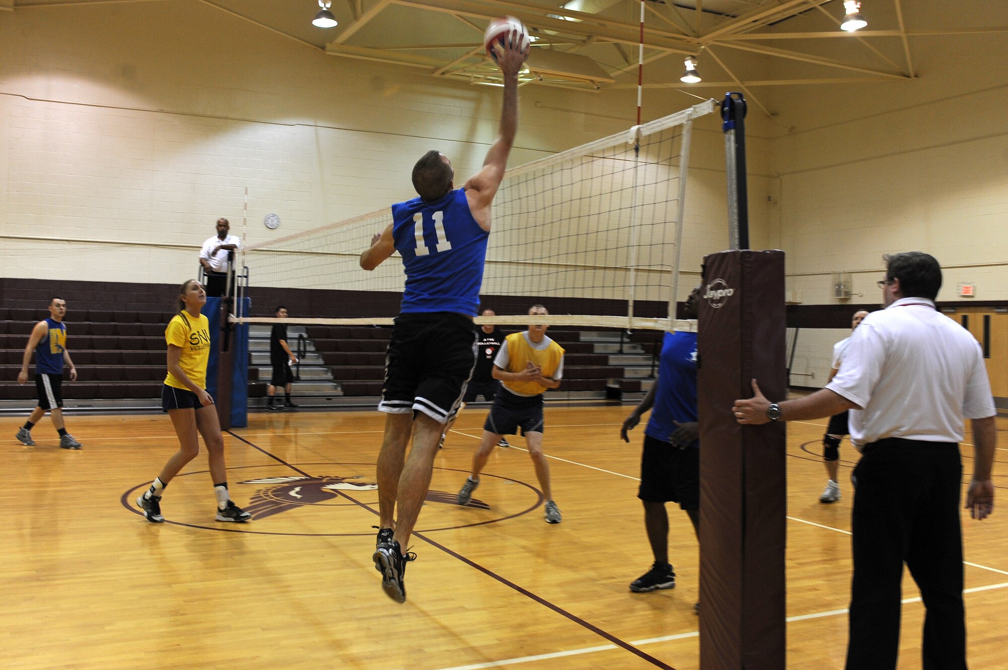 U.S. Air Force Senior Airman Matthew Newkirk, 4th Component Maintenance Squadron avionics technician, spikes a volleyball during the intramural championship game at the fitness center on Seymour Johnson Air Force Base, N.C., Dec. 12, 2012. The 4th CMS team played a best-of-three match against the 4th Force Support Squadron, to determine the 2012 intramural champion. (U.S. Air Force photo/Airman 1st Class John Nieves Camacho/Released)