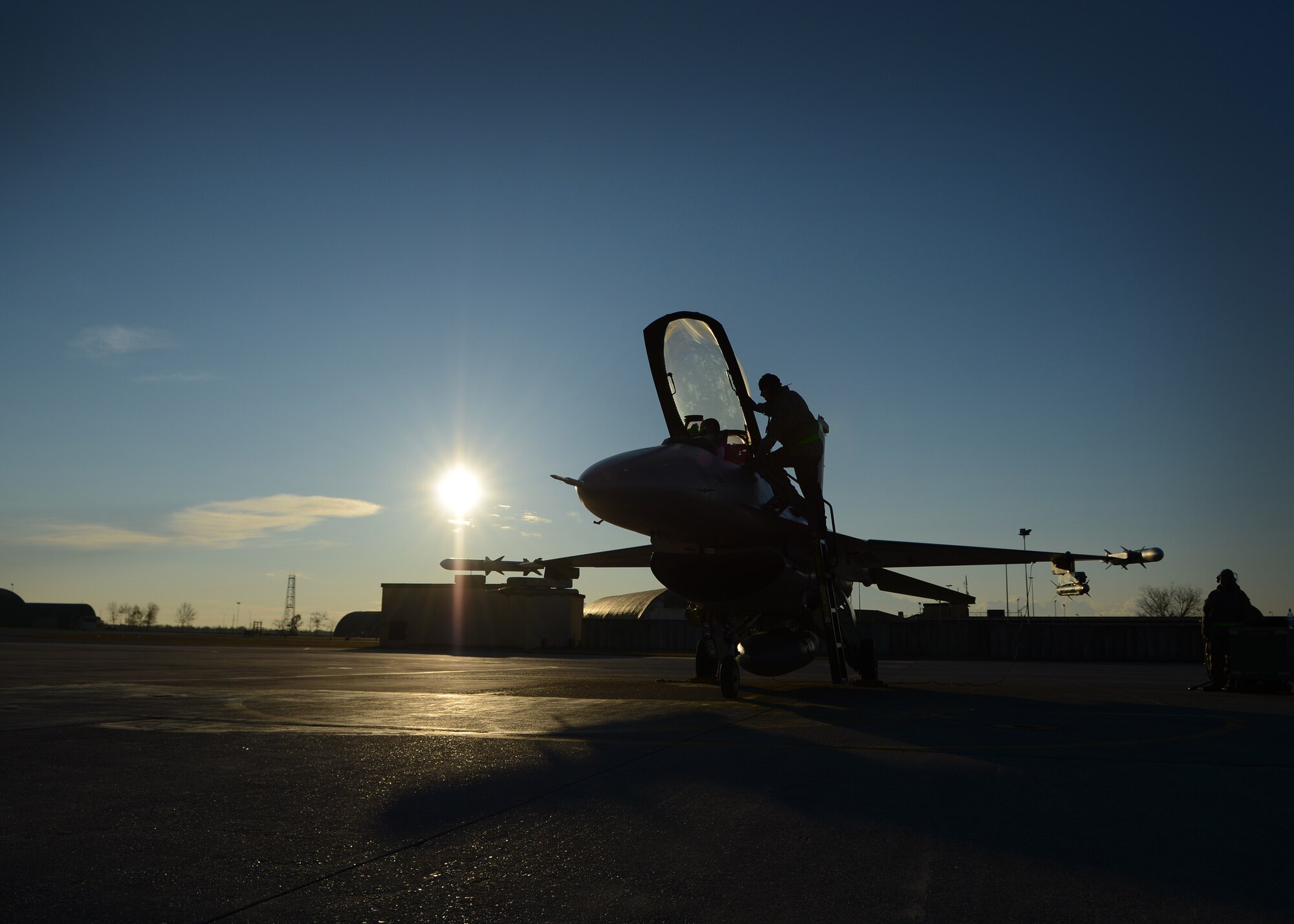 An aircraft maintainer from the 31st Aircraft Maintenance Squadron prepares an F-16 Fighting Falcon for a training sortie Dec. 12 at Aviano Air Base, Italy.  Airmen from the 31st AMXS plan and direct expeditionary aircraft generation and maintenance operations, and maintain two F-16 Fighting Falcon flying squadrons in support of the 31st Fighter Wing’s flying mission. (U.S. Air Force photo/Staff Sgt. Evelyn Chavez)