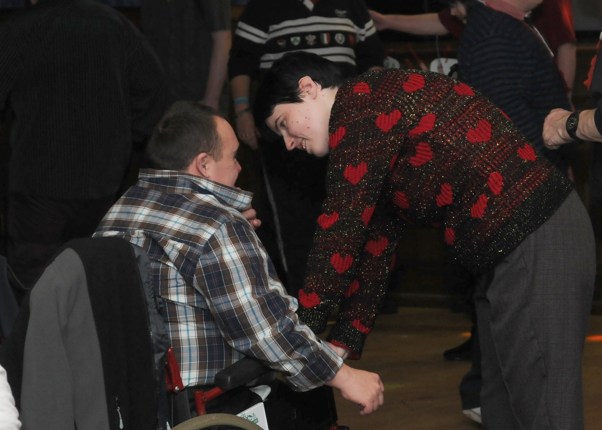 Participants chat while on the dance floor during the Air Force Sergeants Association Special Needs Christmas Party Dec. 15, 2012, at RAF Mildenhall, England. Both local and U.S. individuals attended the party, which included lunch, photos with Santa, dancing and Christmas gifts. (U.S. Air Force photo by Tech. Sgt. Neal X. Joiner/Released)