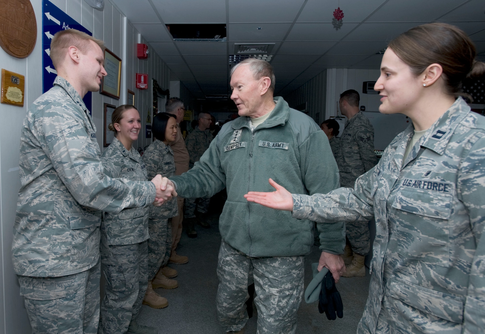 Center, U.S. Army Gen. Martin Dempsey, Chairman of the Joint Chiefs of Staff, meets Airmen from the 376th Expeditionary Medical Group at Transit Center at Manas, Kyrgyzstan, Dec. 14, 2012.  Dempsey and his senior enlisted advisor, U.S. Marine Corps Sgt. Maj. Bryan Battaglia, visited with troops as part of his annual USO holiday tour. (U.S. Air Force photo / Staff Sgt. Stephanie Rubi) 