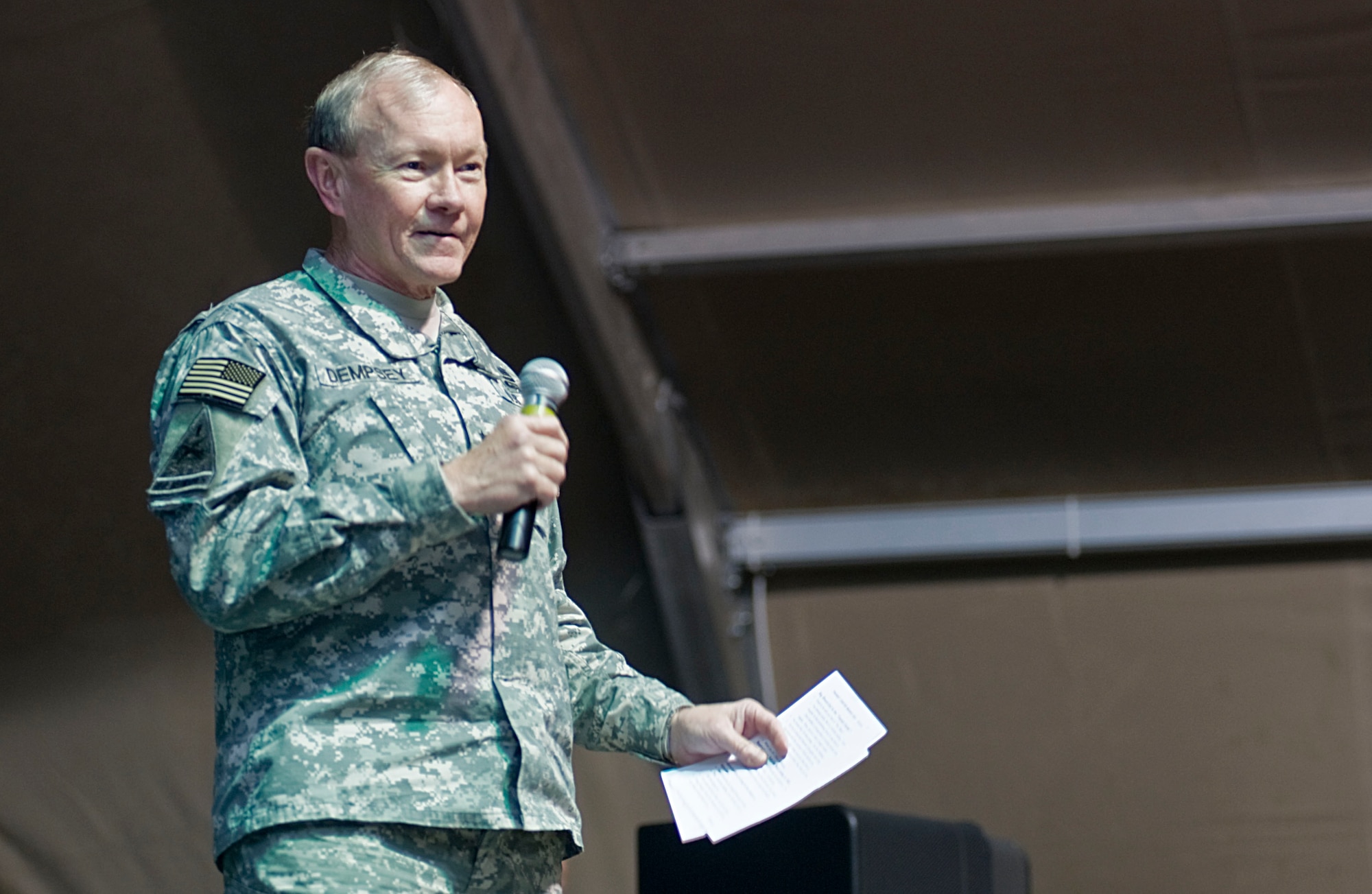 U.S. Army Gen. Martin Dempsey, Chairman of the Joint Chiefs of Staff, speaks to U.S. troops during the USO holiday tour at Transit Center at Manas, Kyrgyzstan, Dec. 14, 2012.   After Kelly Pickler?s performance, Dempsey led the troops in the singing of a holiday song. (U.S. Air Force photo / Staff Sgt. Stephanie Rubi)