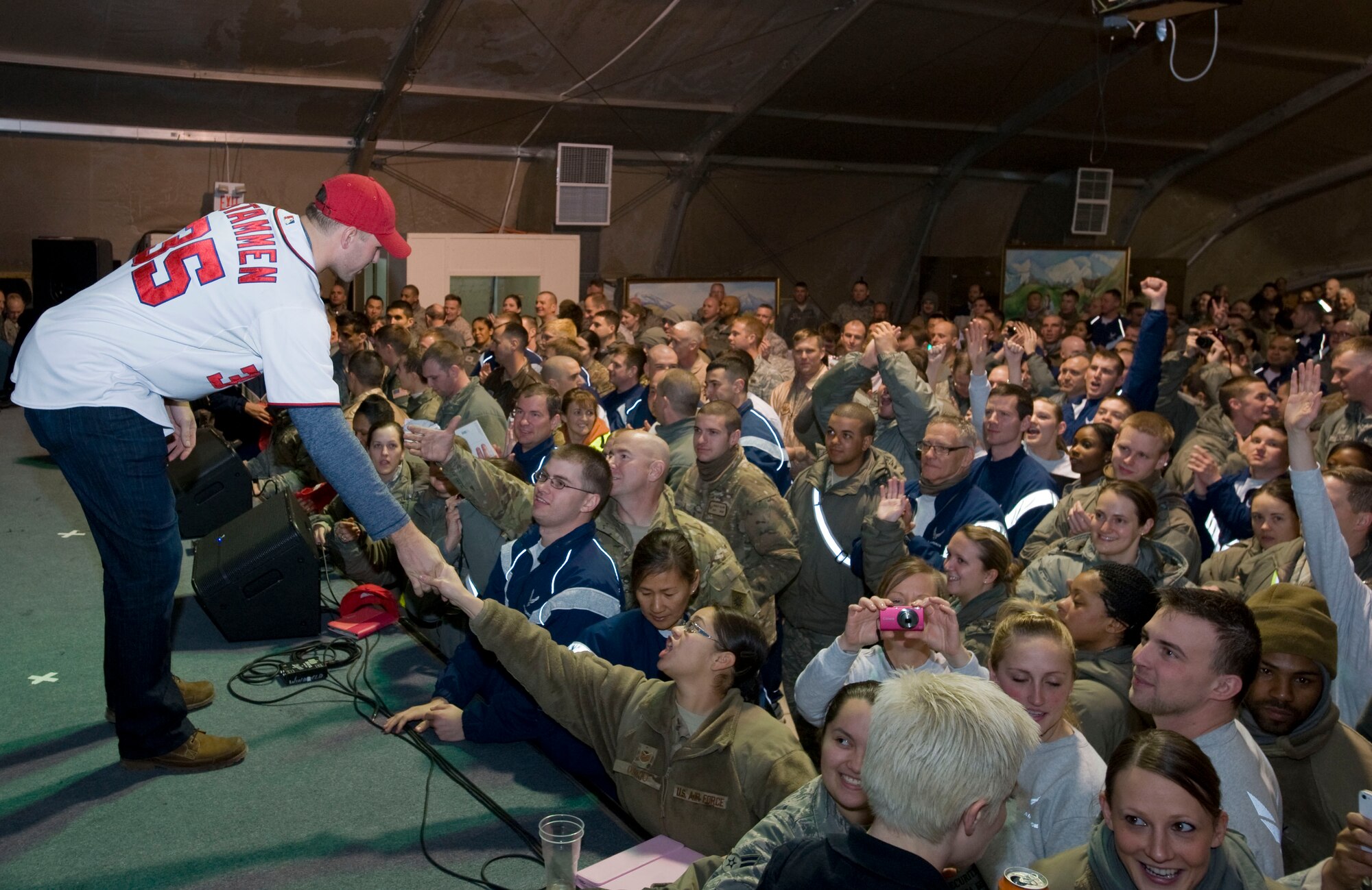 Craig Stammen of Major League Baseball?s Washington Nationals, shakes the hands of U.S. troops during the USO holiday tour at Transit Center at Manas, Kyrgyzstan, Dec. 14, 2012. Stammen and teammate Ross Detwiler, signed autographs and posed for photos with fans after the show. (U.S. Air Force photo / Staff Sgt. Stephanie Rubi)