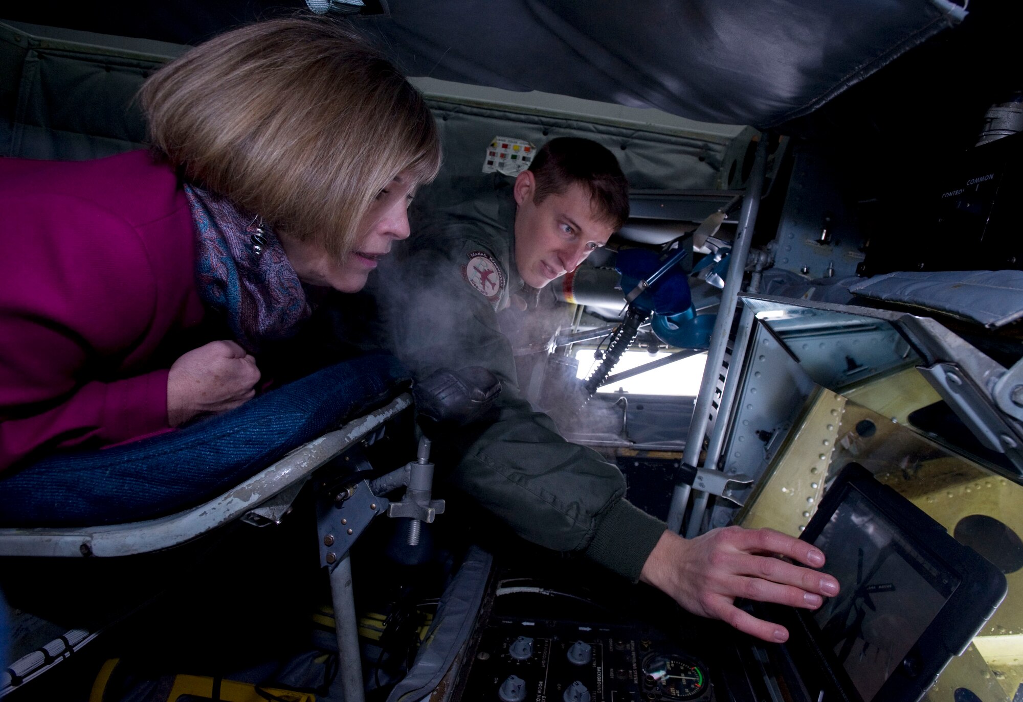Senior Airman Josh Eidson, 22nd Expeditionary Air Refueling Squadron KC-135 Stratotanker boom operator, shows Deanie Dempsey, wife of U.S. Army Gen. Martin Dempsey, Chairman of the Joint Chiefs of Staff, his work space during her visit at the Transit Center at Manas, Kyrgyzstan, Dec. 15, 2012.  Eidson showed Dempsey footage of a refueling mission to illustrate the precision he uses in operating the boom.  (U.S. Air Force photo / Staff Sgt. Stephanie Rubi)