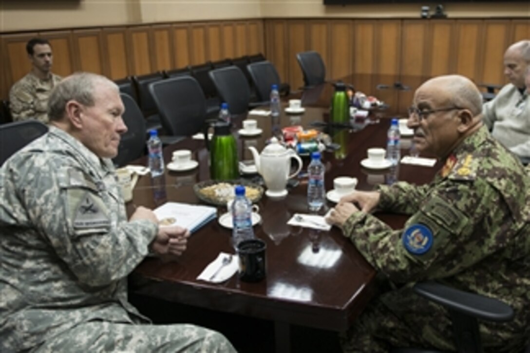 Chairman of the Joint Chiefs of Staff Gen. Martin E. Dempsey, left, and Gen. Sher Mohammad Karimi, Afghan Chief of Army Staff, meet at the International Security Assistance Forces headquarters in Bagram, Afghanistan, on Dec. 15, 2012.  