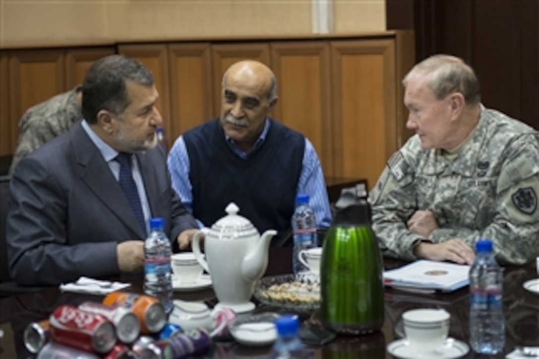 Afghan Minister of Defense Bismillah Khan Mohammadi, left, meets with Chairman of the Joint Chiefs of Staff Gen. Martin E. Dempsey, right, in Bagram, Afghanistan, on Dec. 15, 2012.  