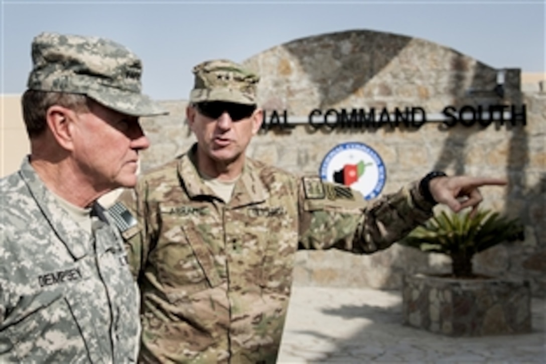 U.S. Army Gen Martin E. Dempsey, chairman of the Joint Chiefs of Staff, left, and U.S. Army Maj. Gen. Robert Abrams, right, Regional Command South Commander, arrive at the command's headquarters Zagabad Forward Operating Base, Afghanistan, Dec. 16, 2012.  
