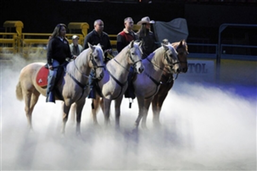 The U.S. Marine Corps Mounted Color Guard rehearses for the 2012 National Finals Rodeo, at the Thomas Mac Center, Las Vegas, Nev., Dec. 11, 2012. 