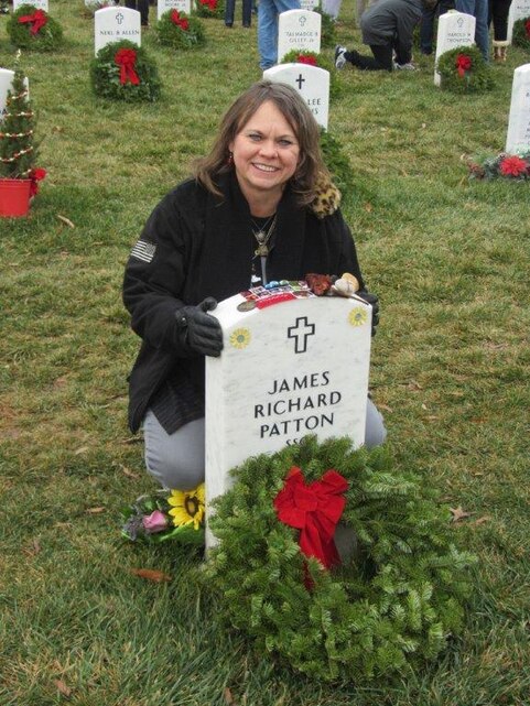 Sheila Patton, mother of Army Staff Sgt. James R. Patton, who was killed in Iraq in 2010, traveled with her daughter from Fort Campbell, Ky., to Arlington National Cemetery in Virginia to participate in the “Wreaths Across America” tribute to fallen U.S. service members, Dec. 15, 2012. 