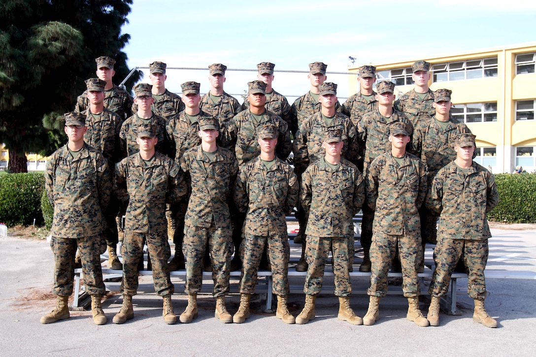 Marines of Platoon 1034, Company B, 1st Recruit Training Battalion, gather together for a group photo two days before graduating recruit training aboard Marine Corps Recruit Depot San Diego Dec. 5. The Marines were part of a group of 24 Minnesota natives who took the enlistment oath in front of a stadium of fans, before the Minnesota Vikings game against the Jacksonville Jaguars at the Metrodome Sept. 9, before leaving for recruit training. The group continued a tradition set by the "Twins Platoon" 45 years ago in 1967, during Vietnam. That group consisted of 150 Minnesota natives who enlisted in a pre-game ceremony before a Minnesota Twins-Boston Red Sox game. The event was repeated last year by another group of 24 Minnesota citizens who recited the oath of enlistment in a ceremony on Sept. 5. The current group completed recruit training and graduated Dec. 7.  