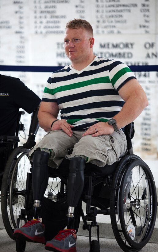PEARL HARBOR, Hawaii - Cpl. Josh Sams sits in the shrine of the USS Arizona Memorial in Pearl Harbor, Hawaii, Nov. 29, in front of a marble wall enscripted with the names of services members who did not survive during the attack, Dec. 7, 1941. Sams explored the memorial and viewed the USS Arizona wreckage that rested below him. (Official U.S. Marine Corps photo by Lance Cpl. Nathan Knapke)