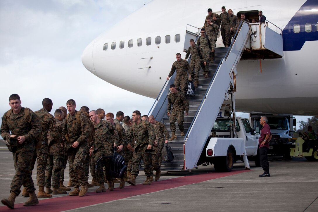 MARINE CORPS BASE HAWAII - Marines with Echo Company, 2nd Battalion, 3rd Marine Regiment, make their way to their families after returning from a six-month Unit Deployment Program to Okinawa, at Hangar 105, Dec. 12, 2012. (Official U.S. Marine Corps photo by Lance Cpl. Jacob D. Barber)
