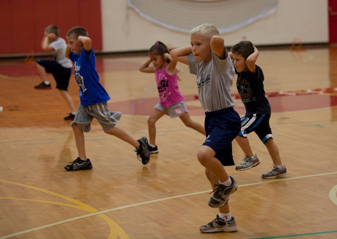 MARINE CORPS BASE HAWAII - Children aboard Marine Corps Base Hawaii participate in High Intensity Tactical Training for Kids, at Semper Fit Center, December 11. The class’s primary focus is to increase speed, quickness, and agility in conjunction with youth sports. The class, which started Dec. 11, was developed and instructed by certified strength and conditioning specialists and is held every Tuesday and Thursday. (Official U.S. Marine Corps photo by Lance Cpl. Jacob D. Barber)