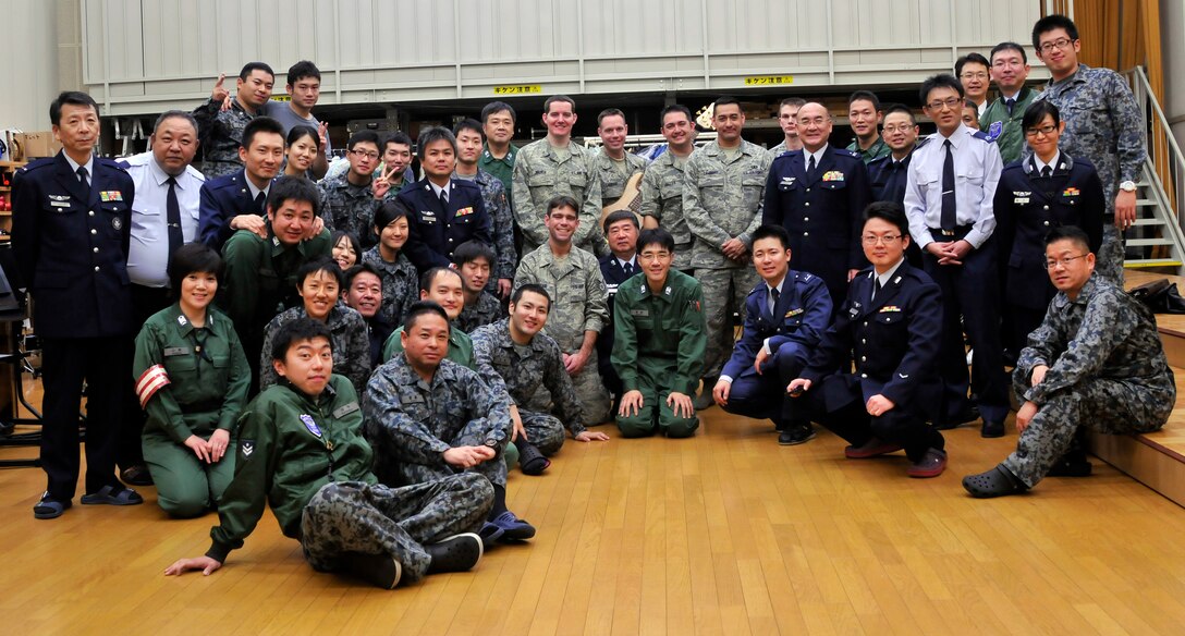 MISAWA AIR BASE, Japan -- Members of the USAF Band of the Pacific-Asia jazz combo pose after a performance with members of the Japan Self Defense Force Northern Band at Misawa Air Base, Misawa, Japan on Dec. 12, 2012.  In addition to performing for US Military forces on Misawa Air Base, the group was able to perform holiday selections for Japanese civilians and military personnel.  (US Air Force Photo/Tech. Sgt. Phillip Butterfield)