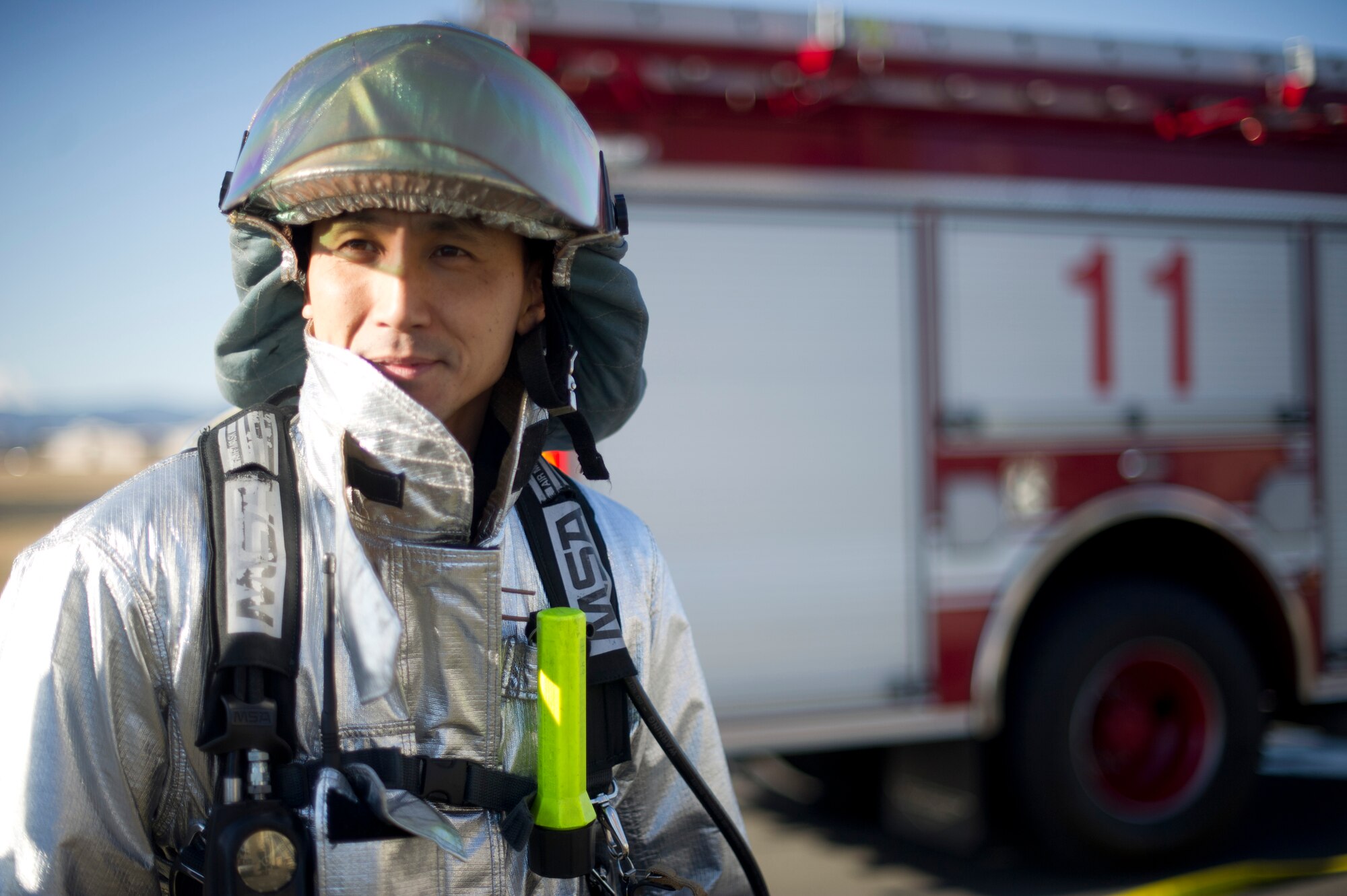 YOKOTA AIR BASE, Japan-- Takeru Kikuchi, a firefighter from the 374th Civil Engineer Squadron at Yokota Air Base, Japan, waits for training suited up in full bunker gear on Dec. 13, 2012. Bunker gear is worn by firefighters to protect them from the scorching temperatures of a fire. (U.S. Air Force photo by Staff Sgt. Stacy Moless)