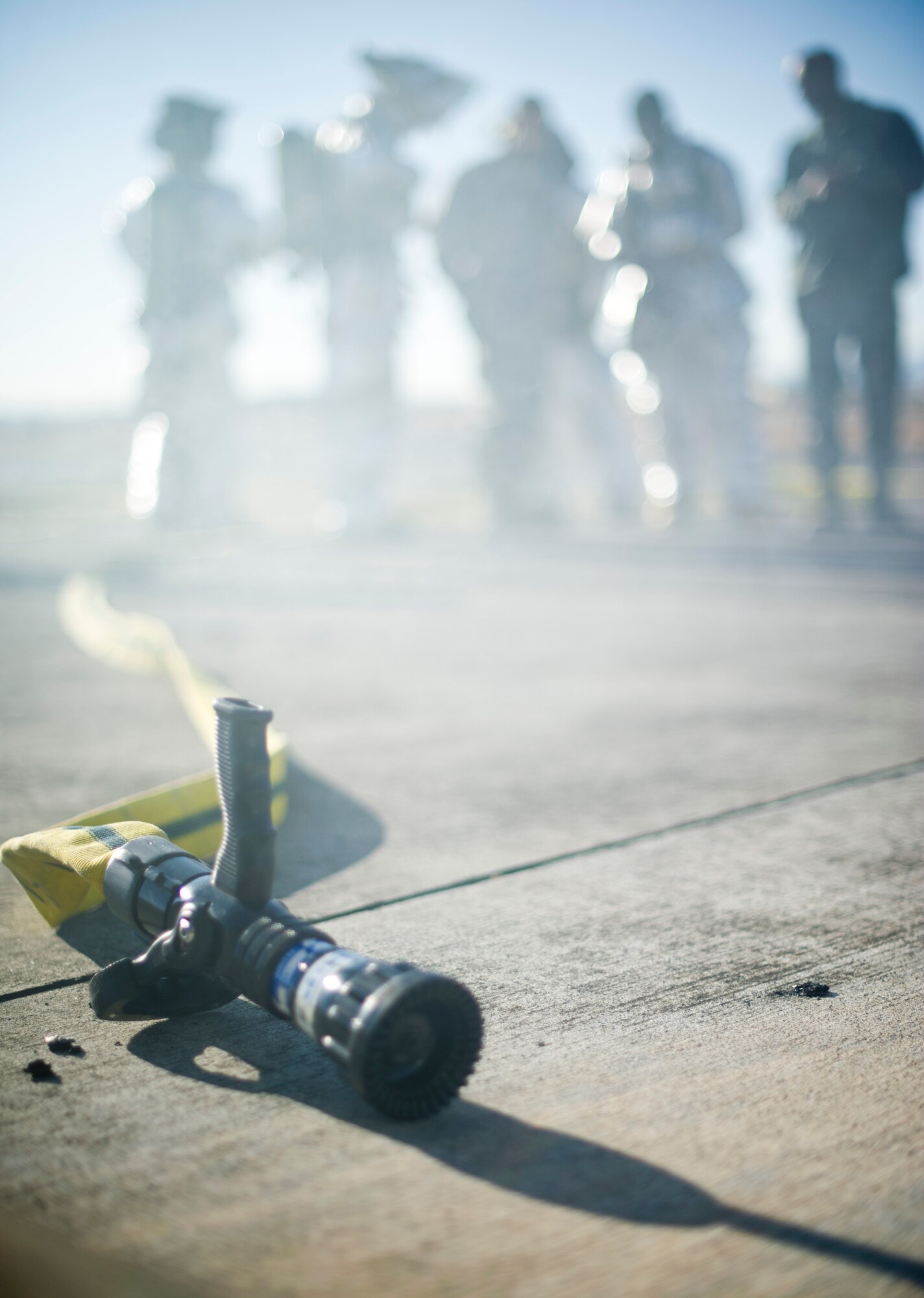 YOKOTA AIR BASE, Japan-- A water hose sits idle as firefighters from the 374th Civil Engineer Squadron at Yokota Air Base, Japan, prepare for a structural burn training exercise on Dec. 13, 2012. The firefighters participate in this type of training to keep their skills sharp so they are prepared to respond to fire emergencies. (U.S. Air Force photo by Staff Sgt. Stacy Moless)