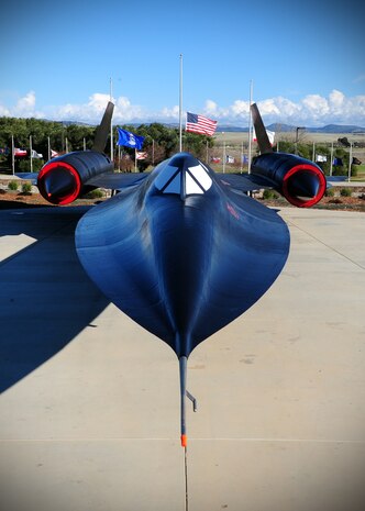 Flags fly at half-staff behind the SR-71 Black Bird static display at Heritage Park at Beale Air Force Base, Calif., Dec. 18, 2012. The flags will be at half-staff until Dec. 18, 2012, in honor of slain students from Sandy Hook Elementary School, Conn. (U.S. Air Force photo by Senior Airman Shawn Nickel/Released)