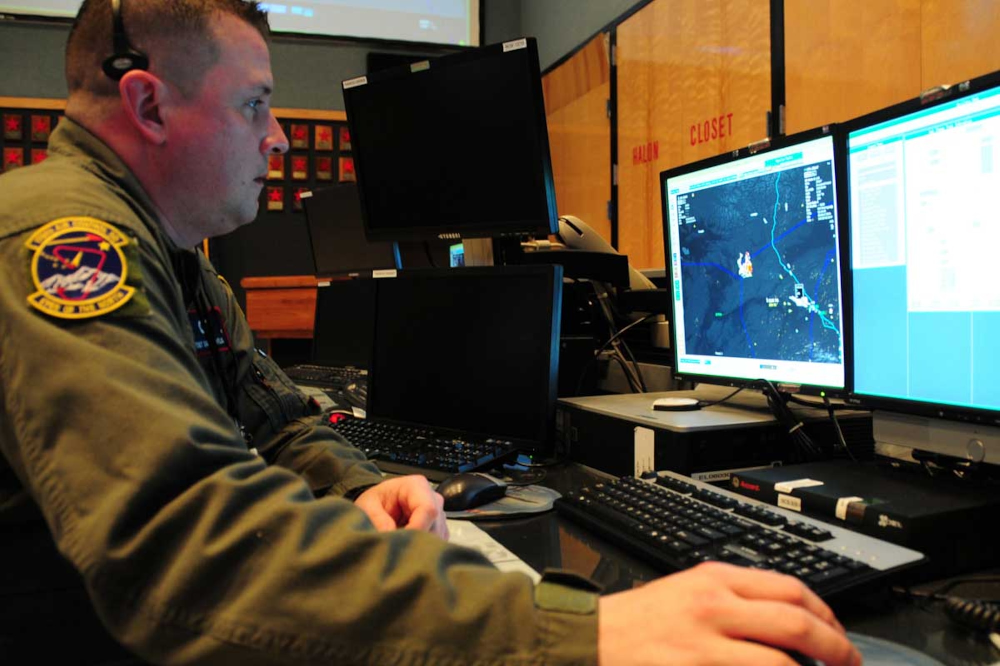 JOINT BASE ELMENDORF-RICHARDSON, Alaska -- Tech. Sgt. David Taylor, 176th Air Control Squadron weapon director technician, monitors Alaskan airspace on the same radar scope he'll use to track Santa's flight Christmas Eve. This radar scope will allow controllers to track Santa’s flight path and ensure his, and his reindeer’s, safety while underway December 24.  Sergeant Taylor, an Anchorage, Alaska, native, works in the Alaskan NORAD Region Regional Air Operations Center (RAOC), a component of ANR comprised of Active Guard members, Canadian Component servicemembers, and active duty augmentees. (U.S. Air Force photo/Master Sgt. Mikal Canfield)