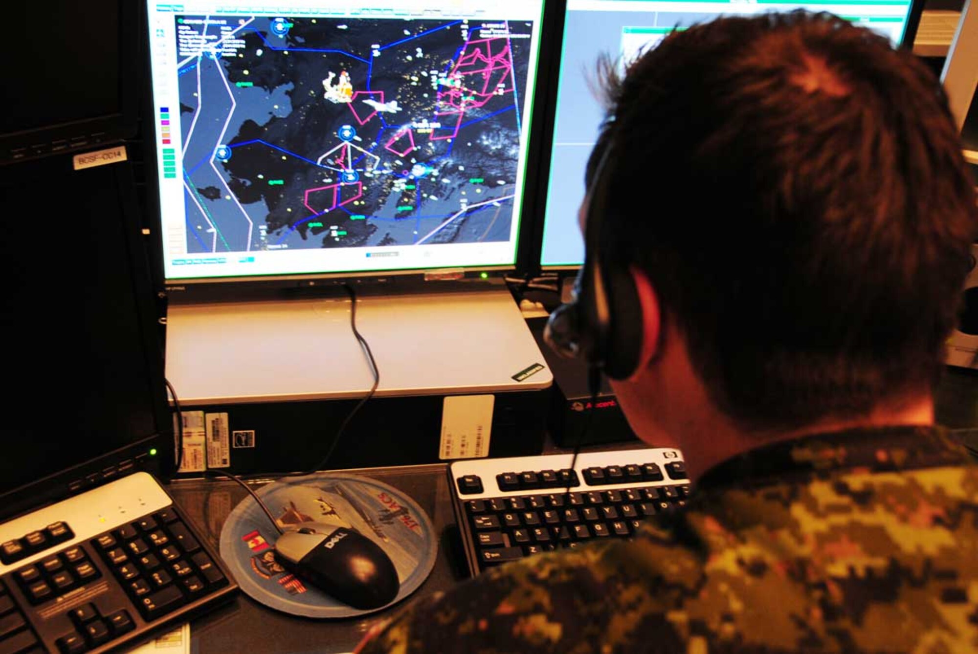 JOINT BASE ELMENDORF-RICHARDSON, Alaska -- Royal Canadian Air Force Capt. Christopher Schenk, an air weapons officer in the Alaskan NORAD Region Regional Air Operations Center (RAOC), displays the way Santa will appear on radar scopes during his flight Christmas Eve. While in ANR airspace, fighter aircraft from Alaska will provide escort to ensure he remains on schedule.  U.S. and Canadian servicemembers utilize 15 radar stations to monitor Santa as he traverses the airspace around the northern latitudes of North America, a mission ANR has successfully accomplished for 50 years. (U.S. Air Force photo/Master Sgt. Mikal Canfield)