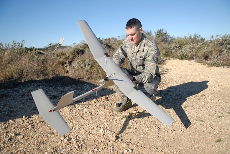 VANDENBERG AIR FORCE BASE, Calif. -- Tech. Sgt. Jeffery Fay from the 30th Security Forces Squadron, inspects the Raven before conducting a test run here Thursday, Feb. 9, 2012. The Raven is an unmanned aerial system that is operated by Airmen here at the 30th SFS. (U.S. Air Force photo/Jennifer Green-Lanchoney)