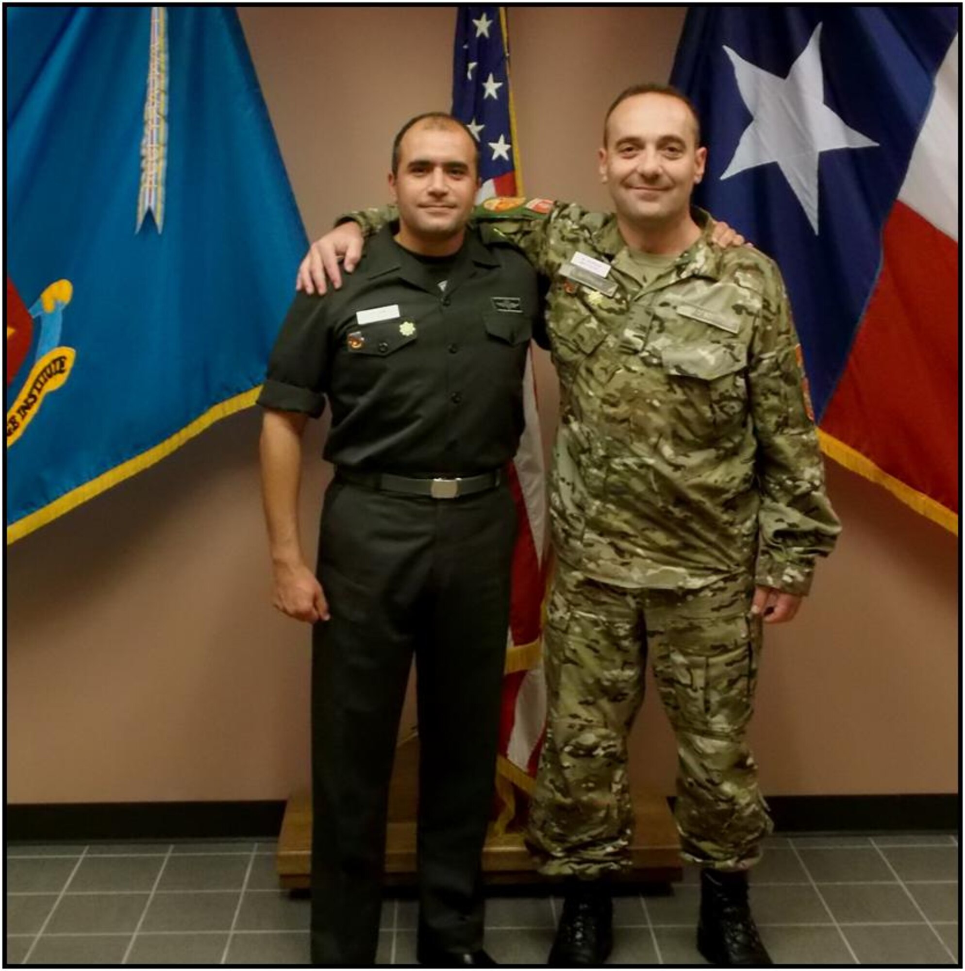 Maj. Saidin, Egyptian Army (left), stands next to his classmate and wingman, Maj. Skupnjak, from the Montenegro Army.  (U.S. Air Force Courtesy Photo)