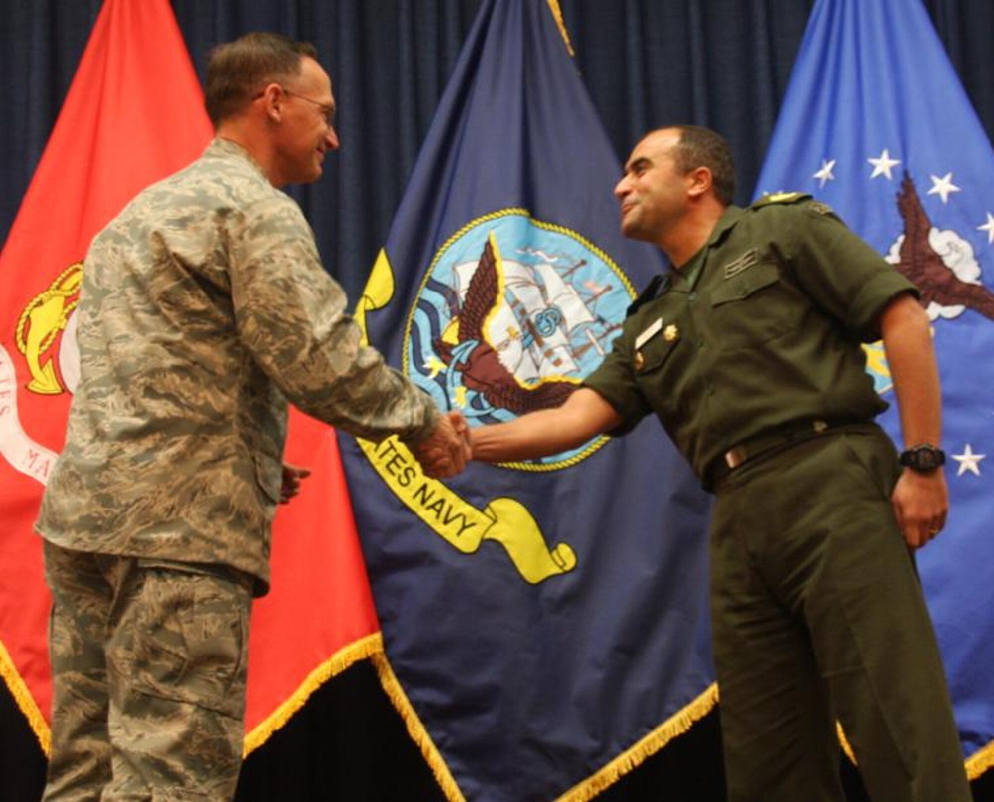 Egyptian Maj. Wael Mahmoud Thabit Saidin was praised for showing a fellow student, Montenegrin Maj. Krunoslav Skupnjak, the true meaning of being a Wingman. He received a commander’s coin from Col. James Garrett, DLI commandant, at a Nov. 30 graduation. (U.S. Air Force Courtesy Photo)