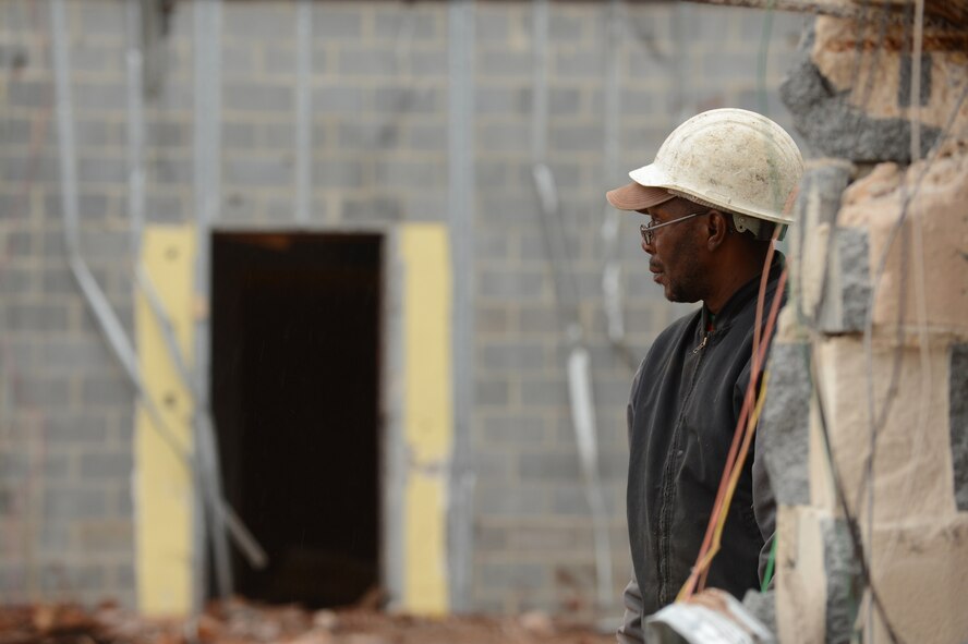 A construction worker watches the demolition of the old base exchange at Shaw Air Force Base, S.C., Dec.12, 2012.  (U.S. Air Force photo by Airman 1st Class Nicole Sikorski/Released)