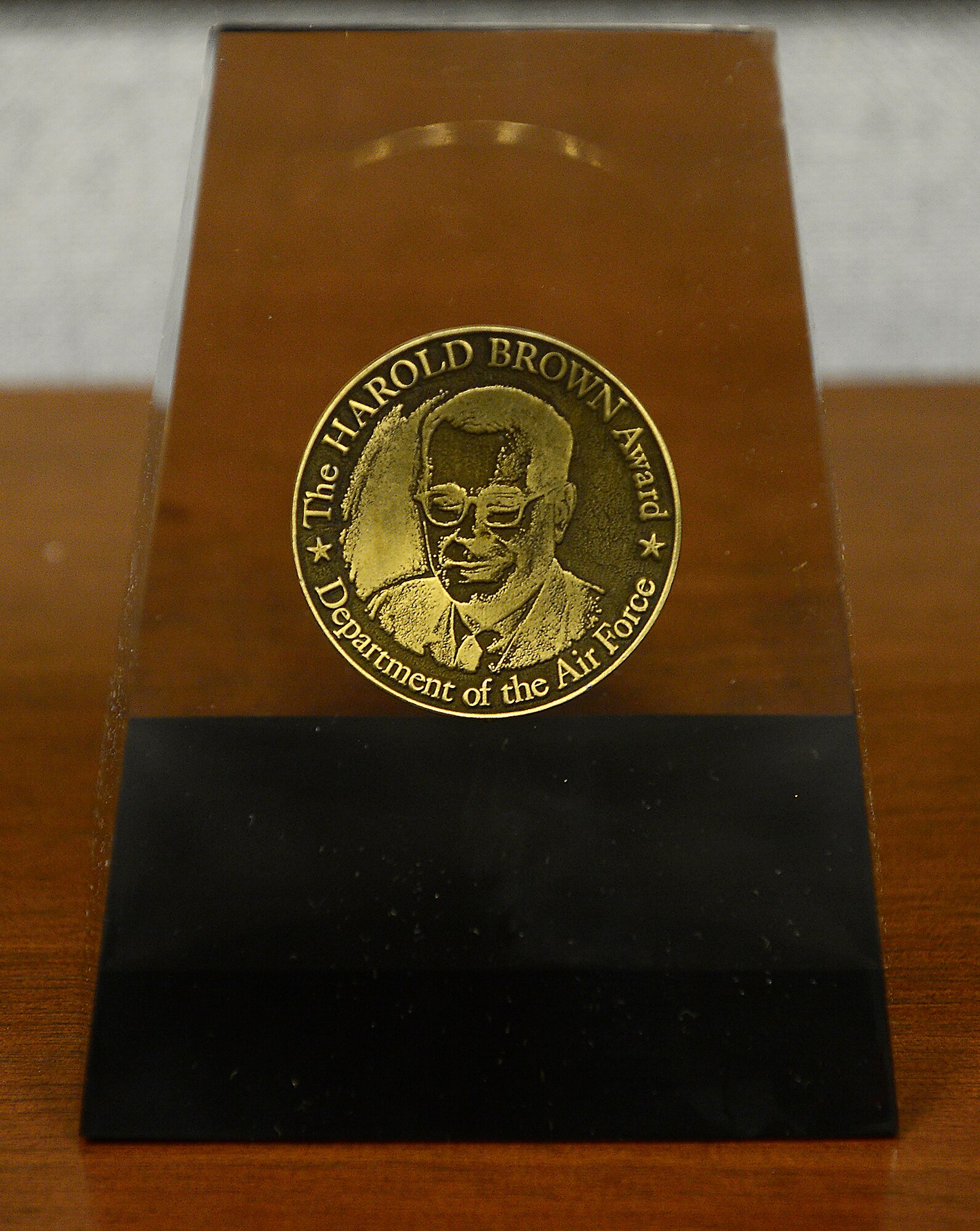 The trophy which accompanies the Harold Brown Award awaits the 2012 presentation to Dr. Mark Draper by Secretary of the Air Force Michael Donley during a Pentagon ceremony Dec. 17, 2012. Donley presented Draper the award for his significant achievement in research and development. As a leader and international authority on user interfaces and supervisory control optimization for remotely piloted aircraft, Draper's accomplishments have been directed at improvements to RPA operator interfaces and future warfighting capabilities. Draper is a senior engineering research psychologist with the Air Force Research Laboratory's 711th Human Performance Wing at Wright-Patterson Air Force Base, Ohio. (U.S. Air Force photo/Scott M. Ash)