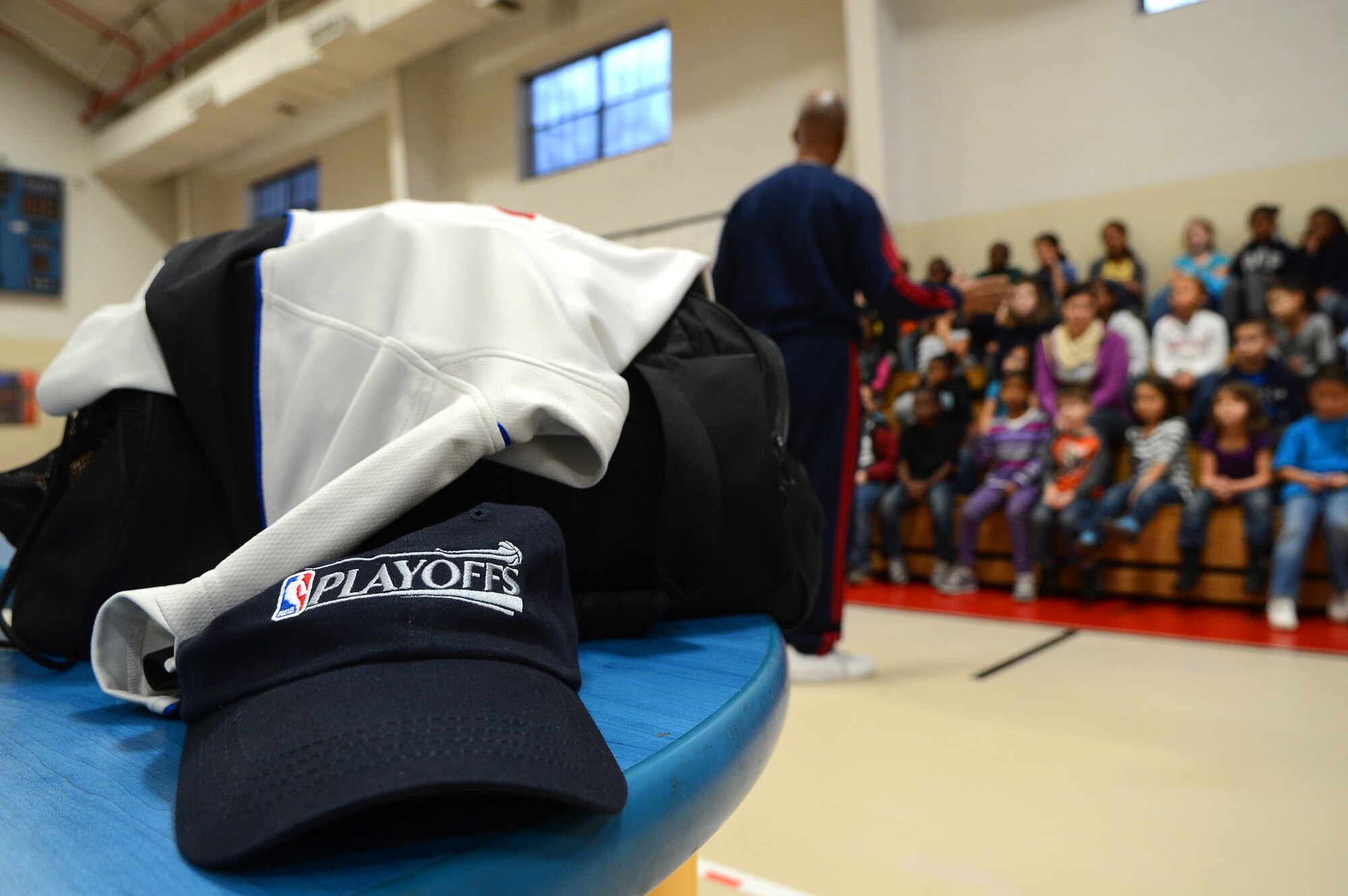 A National Basketball Association hat along with the belongings of Derrick Stafford, NBA referee, sits on a table as Stafford speaks to kids at the Shaw Air Force Base youth center, S.C., Dec. 14, 2012.  Stafford is in his 25th NBA season and has served twice on the executive board of the NBA Referee Association.  (U.S. Air Force photo by Airman 1st Class Nicole Sikorski/Released)