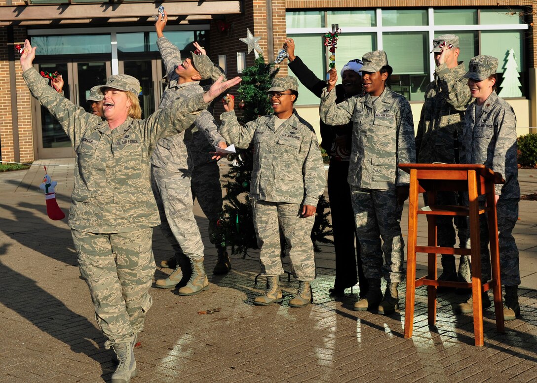 Team Andrews' members sing Christmas carols outside of the Jones Building, Dec. 18, 2012. The carolers will be singing every morning beginning at 9 a.m. from Dec 17- Dec. 19 to promote holiday cheer. (U.S. Air Force photo/ Airman 1st Class Erin O’Shea