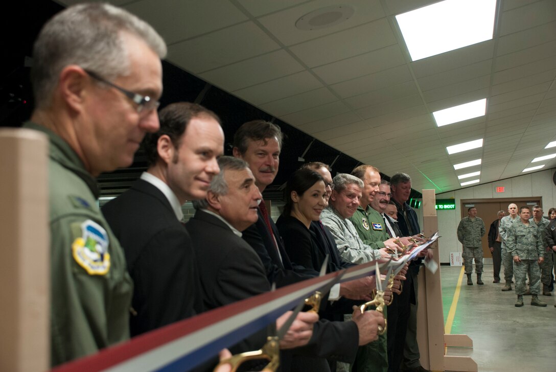 Military and civilian leaders from across the area gather to cut a ribbon signaling the opening of indoor small arms firing range at the Niagara Falls Air Reserve Station, December 18. This 28,000 square foot state-of-the-art joint use facility has 21 firing lanes and will support year-round firearms training for Airmen assigned to NFARS and other military units and law enforcement agencies in western New York. (U.S. Air Force photo by Tech. Sgt. Andrew Caya)