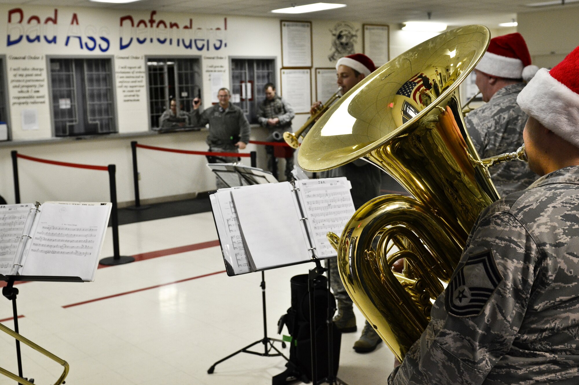 The Golden West Brass Quintet from Travis Air Force Base, Calif., plays holiday carols for members of the 92nd Security Forces Squadron during their visit at Fairchild Air Force Base, Wash., Dec. 14, 2012. The band visited Fairchild and the surrounding community Dec. 13 and 14, playing holiday classics such as “We wish you a Merry Christmas” and “Jingle Bell Rock.” (U.S. Air Force photo by Senior Airman Benjamin Stratton)