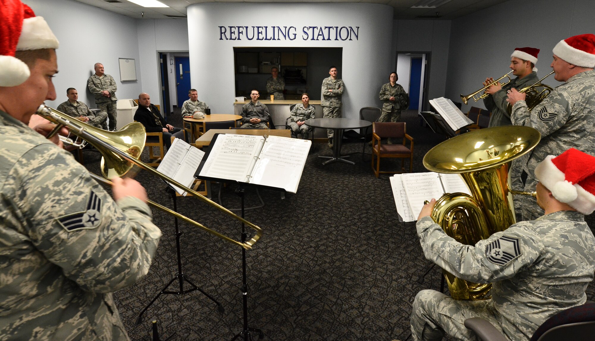The Golden West Brass Quintet from Travis Air Force Base, Calif., plays holiday carols for members of the 92nd Maintenance Group during their visit at Fairchild Air Force Base, Wash., Dec. 14, 2012. The band visited Fairchild and the surrounding community Dec. 13 and 14. (U.S. Air Force photo by Senior Airman Benjamin Stratton)