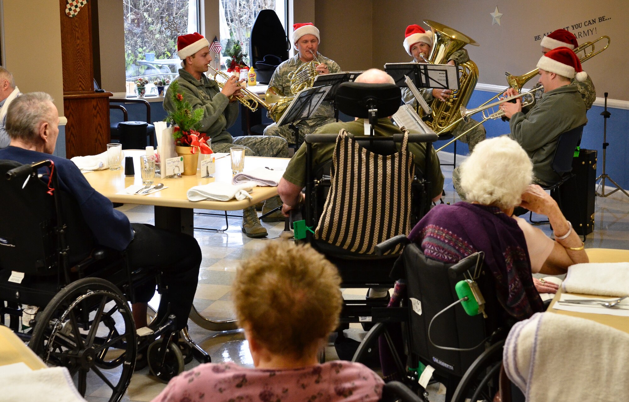The Golden West Brass Quintet from Travis Air Force Base, Calif., plays holiday carols for veterans and staff of the Spokane Veterans Homes in Spokane, Wash., Dec. 13, 2012. The band visited Fairchild and the surrounding community Dec. 13 and 14, playing holiday classics such as “We wish you a Merry Christmas” and “Jingle Bell Rock.” (U.S. Air Force photo by Senior Airman Benjamin Stratton)