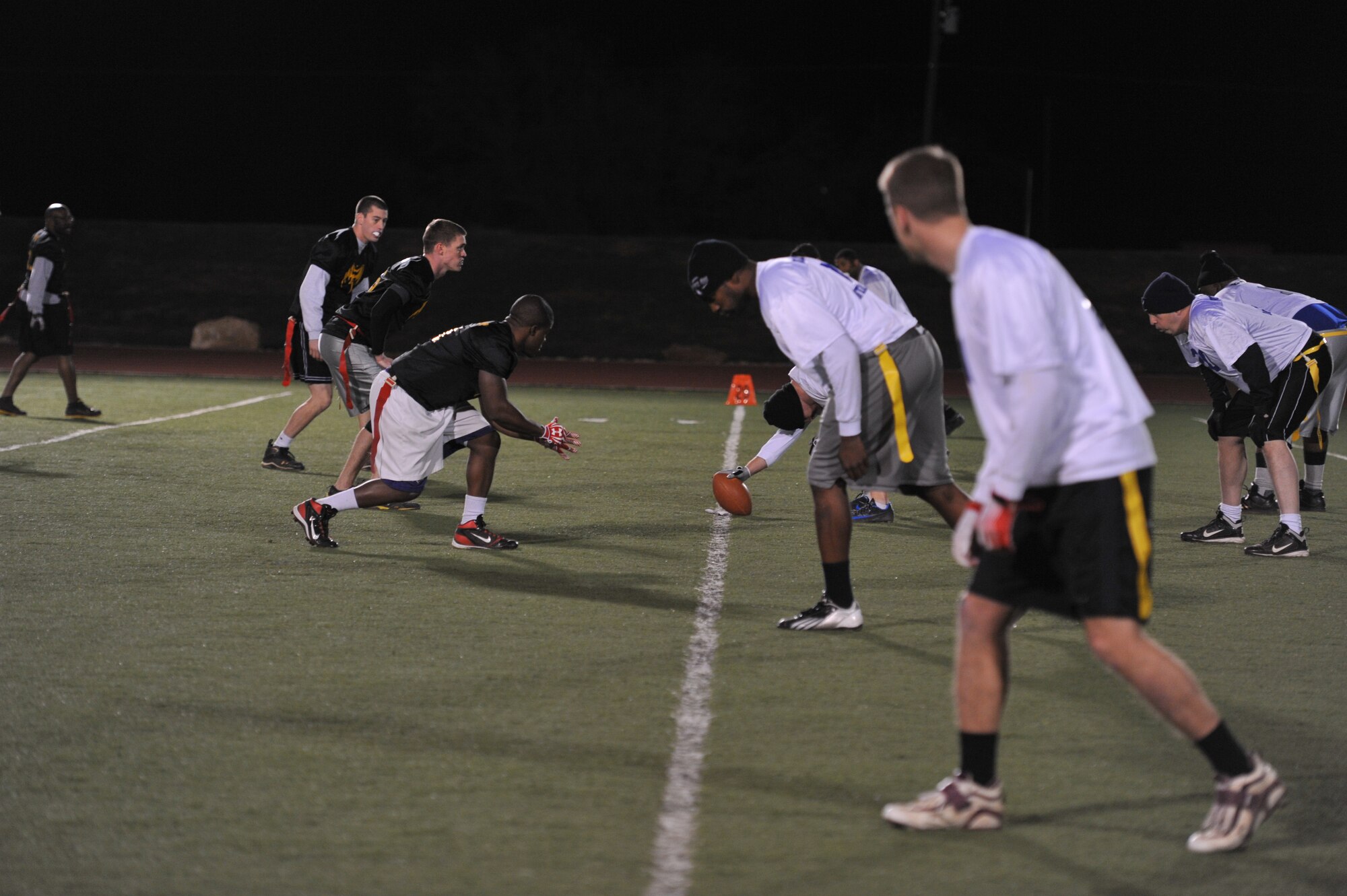 GOODFELLOW AIR FORCE BASE, Texas- The Junk Yard Dogs compete against The Combats in the Flag Football Intramural Championship game at the football field here, Dec. 12. The Junk Yard Dogs won the championship for the third time in a row. (U.S. Air Force photo/ Airman 1st Class Erica Rodriguez)