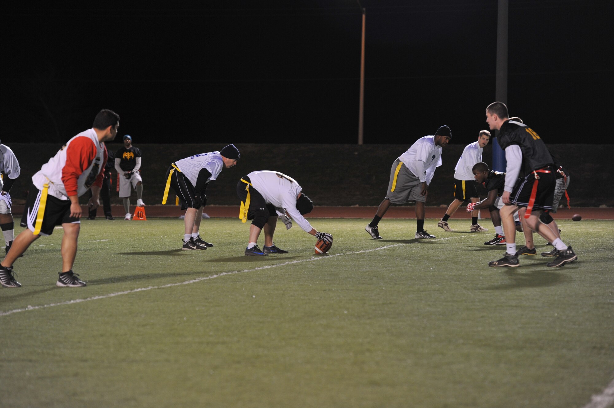 GOODFELLOW AIR FORCE BASE, Texas- The Junk Yard Dogs compete against The Combats in the Flag Football Intramural Championship game at the football field here, Dec. 12. The Junk Yard Dogs won the championship for the third time in a row. (U.S. Air Force photo/ Airman 1st Class Erica Rodriguez)