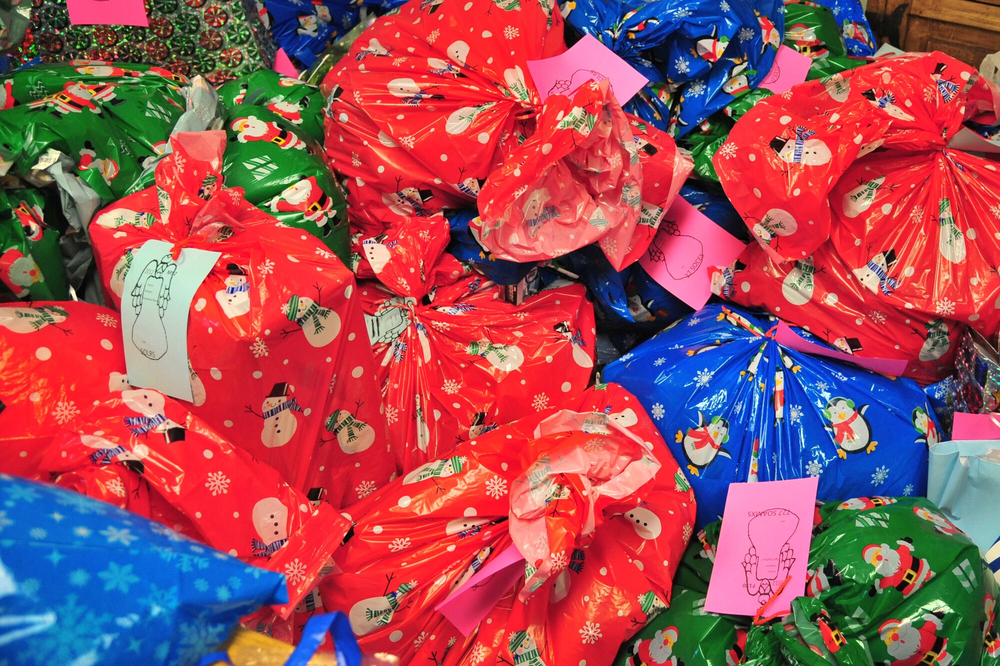 Piles of gifts donated through the Angel Tree program sit in the Thrift Shop at Cannon Air Force Base, N.M., Dec. 18, 2012. More than 300 gifts were provided from generous members of the wing to ensure that every child within the Cannon community has presents under their tree this year. (U.S. Air Force photo/Senior Airman Alexxis Pons Abascal) 