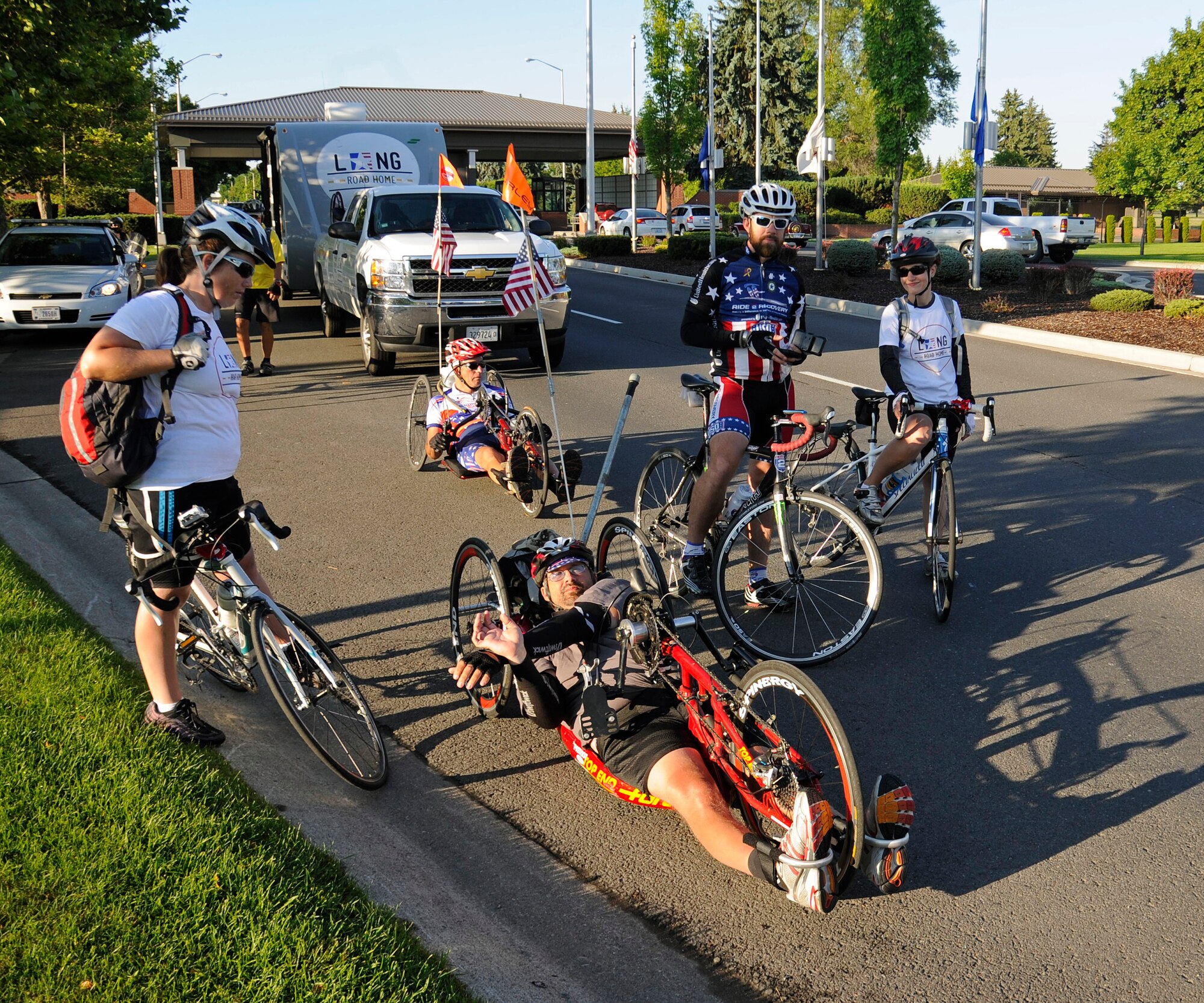 All five riders of the Long Road Home Project prepare to depart Fairchild Air Force Base, Wash., July 25, 2012. Their 4,200 mile journey began on July 15, and will end up in Washington, D.C. (U.S. Air Force photo by Airman 1st Class Ryan Zeski) 