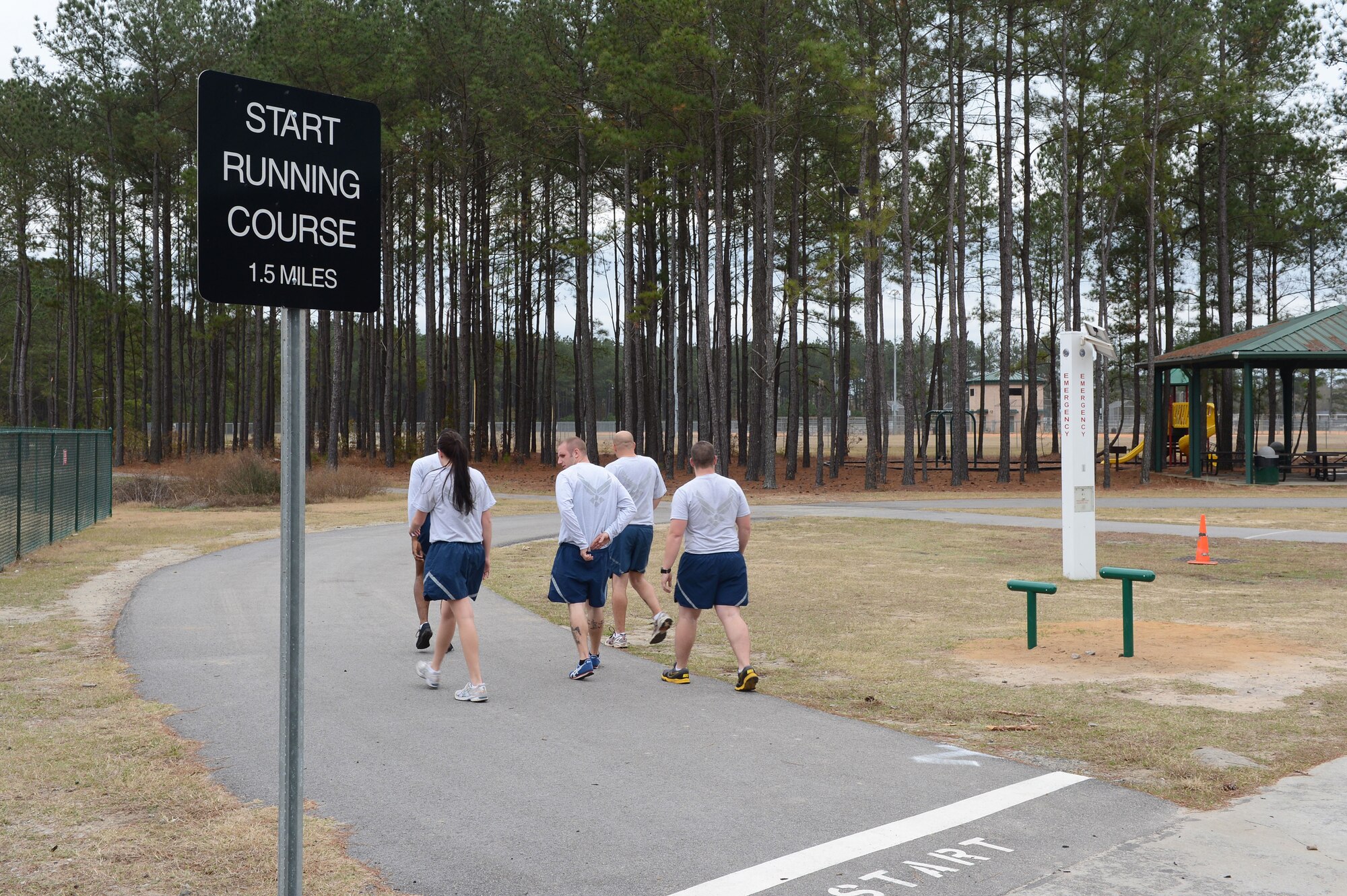A group of Airmen prepare to start flight physical training at the east sports complex mile-and-a-half running trail. (U.S. photo by Airman 1st Class Daniel Blackwell/Released)