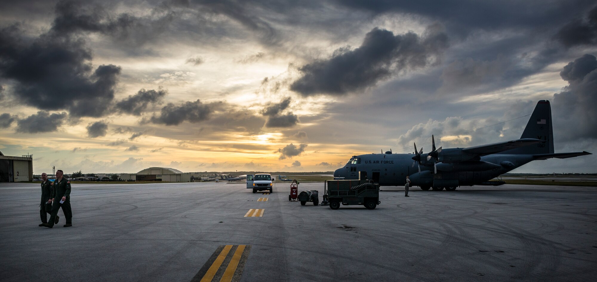 ANDERSEN AIR FORCE BASE, Guam -- Pilots from the 36th Airlift Squadron at Yokota Air Base, Japan, walk away from their C-130 Hercules parked at Andersen Air Force Base, Guam, Dec. 18, 2012. The crew successfully completed the last airlift mission for Operation Christmas Drop, a 61-year-old humanitarian mission carrying donated supplies to the islands of Micronesia. (U.S. Air Force photo by Tech. Sgt. Samuel Morse)