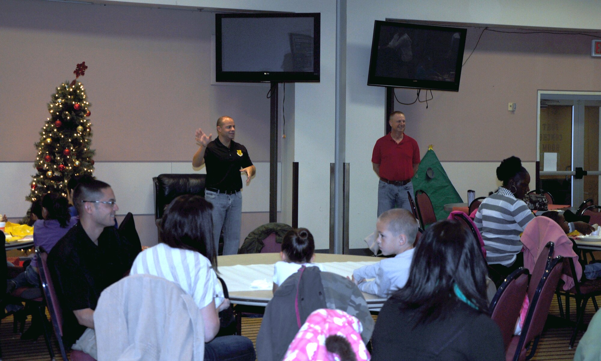 GOODFELLOW AIR FORCE BASE, Texas—Col. Mark Damiano, 17th Training Wing Commander, welcomes families of deployed service members to the annual Breakfast With Santa gathering at the Event Center Dec 15. The event included family activities, food and a visit from Santa. (U.S. Air Force photo/Airman 1st Class Jessica Keith) 