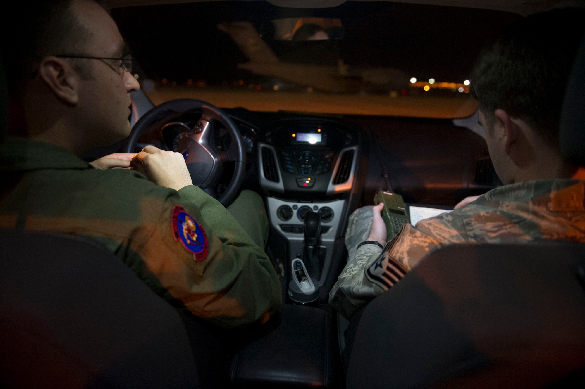 Airmen from the 621st Contingency Response Wing wait for aircraft to land during the Mission Employment phase exercise at Nellis Air Force Base, Nev. December 5, 2012. More than 60 Airmen from the 621st Contingency Response Wing got a chance to hone their skills and help train Weapons School students. (U.S. Air Force photo by Staff Sgt. Gustavo Gonzalez)