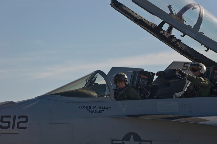 Lt. Cmdr. Travis Inouye and Lt. Cmdr. Brian Johnson, Electronic Attack Squadron 138 pilots, prepare to take off during the U.S. Air Force Weapons School Mission Employment Phase Dec. 11, 2012, at Nellis Air Force Base, Nev. VAQ 138 is an expeditionary EA-18G Growler squadron assigned to U.S. Naval Air Station Whidbey Island, Washington. Their mission is to project Electronic Attack dominance anywhere in the world at any time by providing fully combat ready aircraft and personnel. (U.S. Air Force photo by Senior Airman Matthew Lancaster)