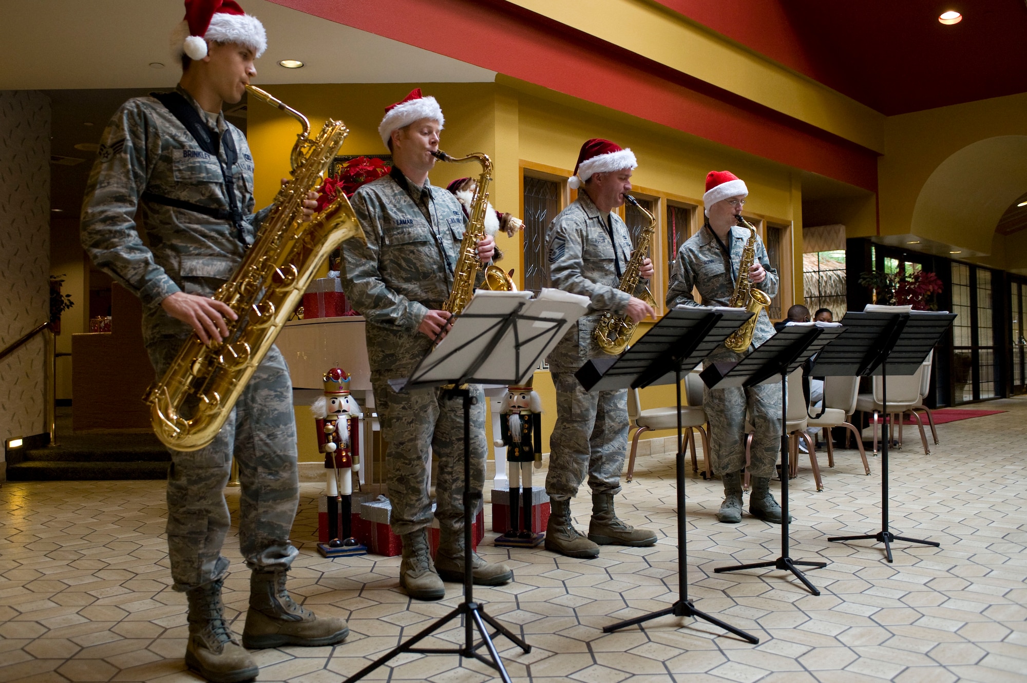 U.S. Air Force Band of the Golden West plays holiday musicals Dec. 14, 2012, at Nellis Air Force Base, Nev. During the holidays, the band breaks up into smaller groups to provide holiday cheer for those who cannot be with their loved ones. (U.S. Air Force photo by Airman 1st Class Christopher Tam)
