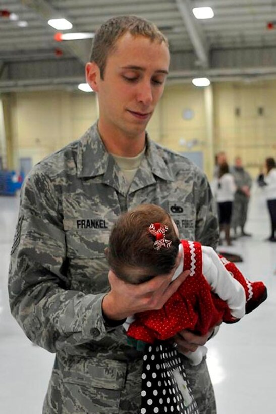 U.S. Air Force Technical Sergeant Trevor Frankel brings his daughter to see Santa Claus at the base Christmas Party at the 182nd Airlift Wing, Peoria, IL on Decmber 2, 2012.  (U.S. Air Force photo by Master Sergeant Scott Thompson/Released)