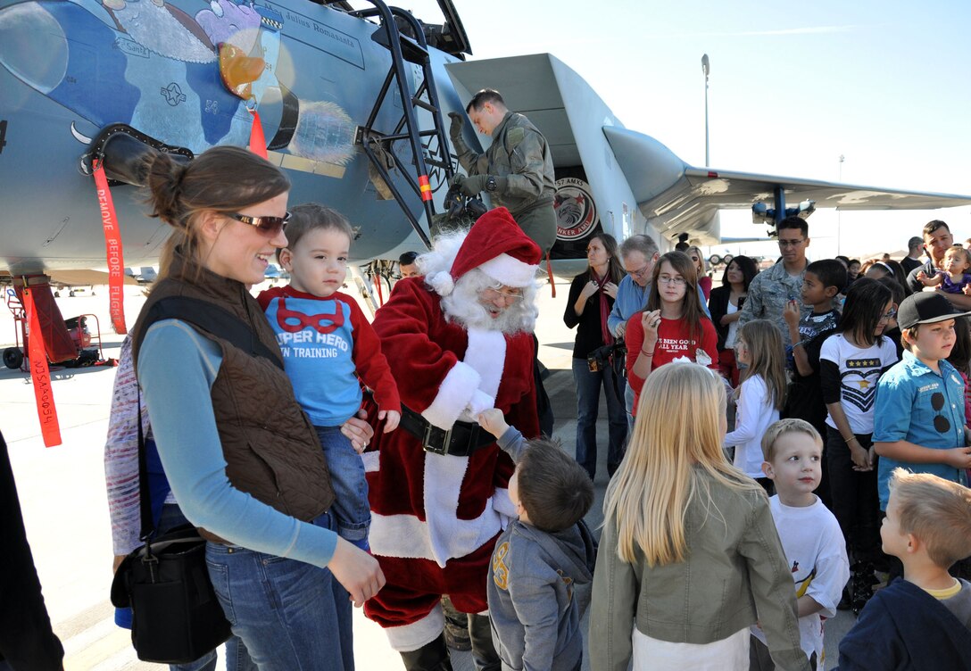 NELLIS AIR FORCE BASE, Nev. -- Santa taxis in to greet families at the flightline here Dec. 8. The visit was part of an annual holiday party hosted by the base's Reserve and Regular Air Force maintenance units. (U.S. Air Force photo/Maj. Jessica Martin)