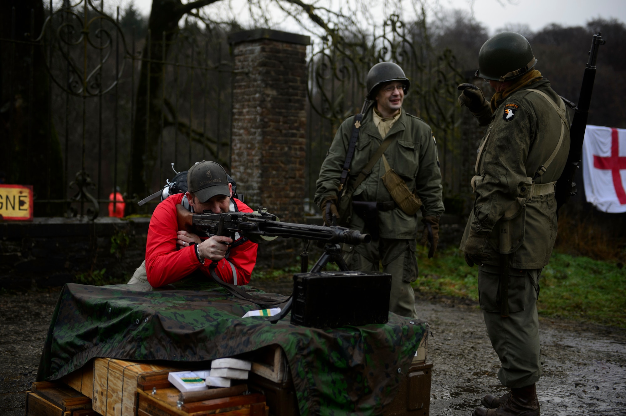 BASTOGNE, Belgium – U.S. Air Force Master Sgt. Kenneth Snyder, 52nd Fighter Wing command post, aims down the sights of a German-made machine gun during the Bastogne Historic Walk Dec. 15, 2012. Bastogne is about 110 kilometers from Spangdahlem Air Base, Germany, and has many monuments and memorials about World War II in the area. (U.S. Air Force photo by Staff Sgt. Nathanael Callon/Released)
