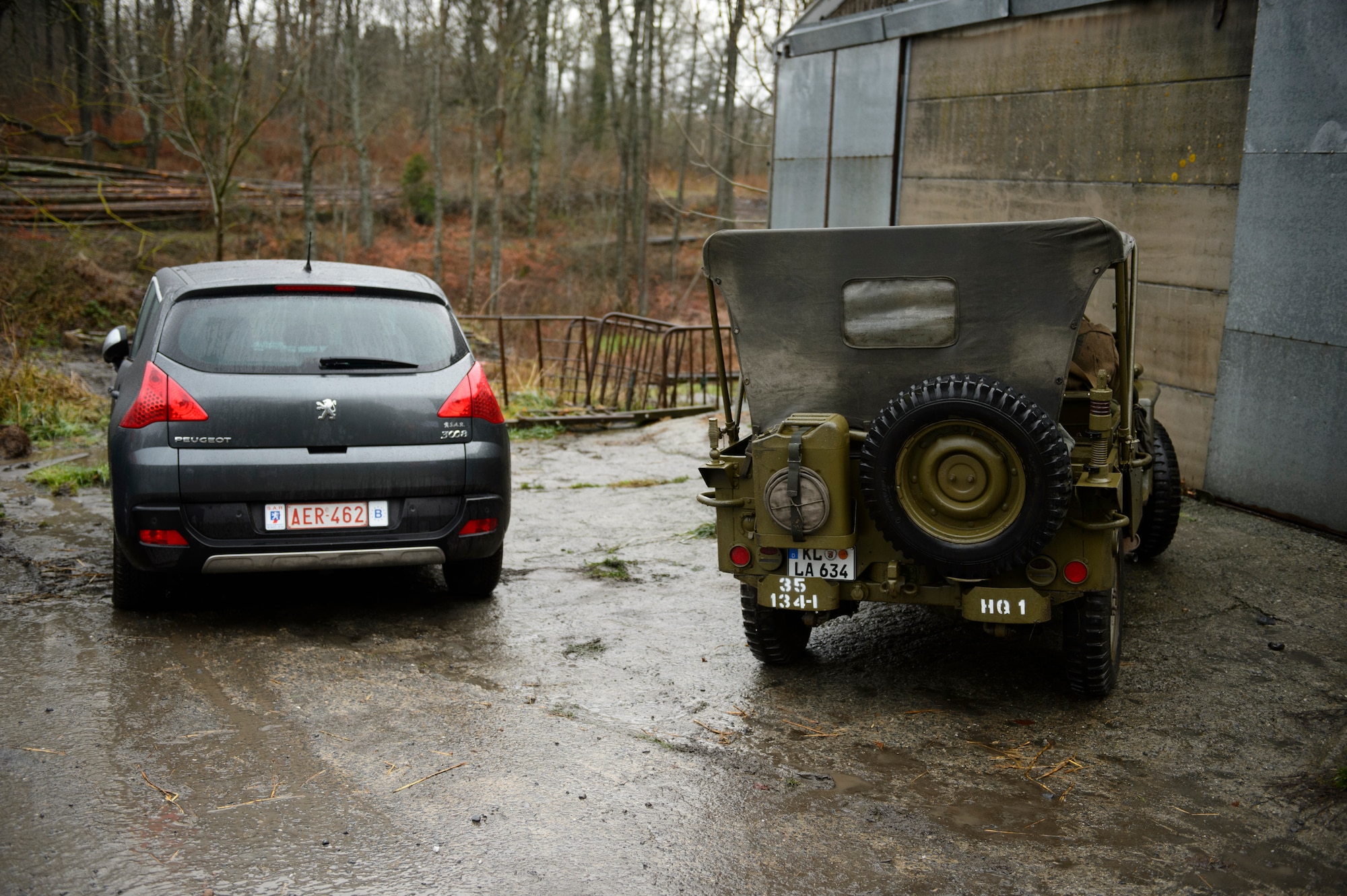 BASTOGNE, Belgium – A World War II era jeep is parked next to a newer car during the Bastogne Historic Walk Dec. 15, 2012. Memorabilia is not just limited to uniforms, insignias and weapons, but also includes standard-issue tents and vehicles from the era. (U.S. Air Force photo by Staff Sgt. Nathanael Callon/Released)